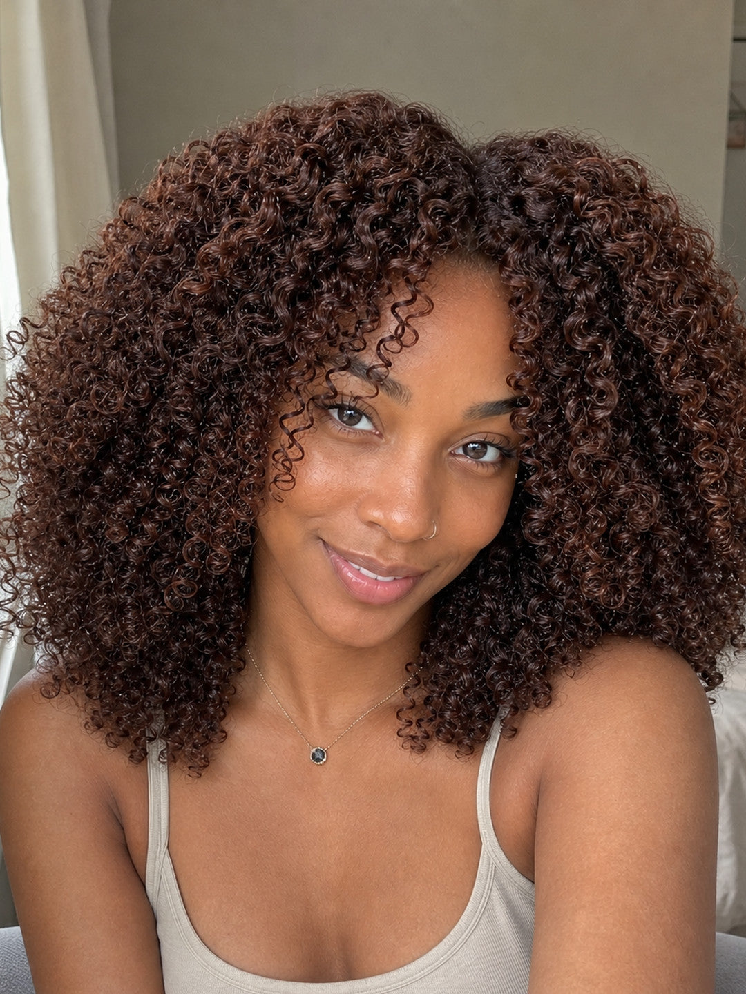 Same Afro Kinky Curly campaign model in a curl-definition close-up