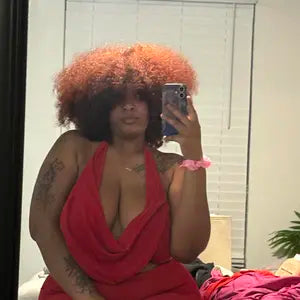 Shopper wearing a natural-looking 16 inch curl style