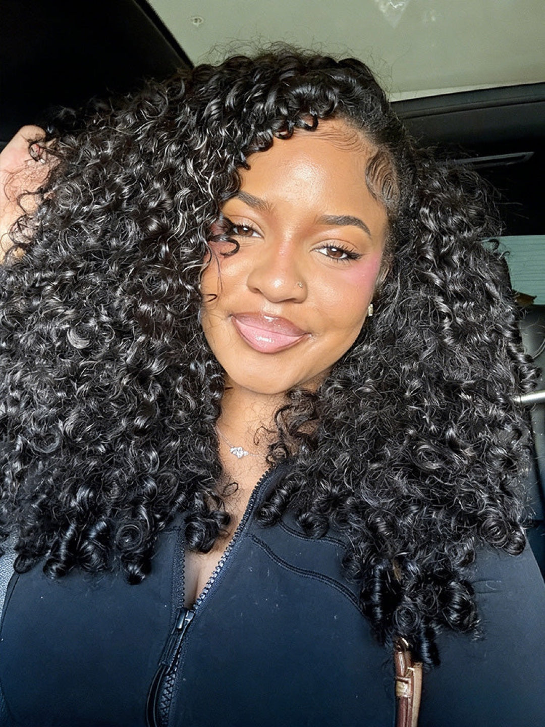Woman wearing long natural black Burmese Curly hair in a casual setting