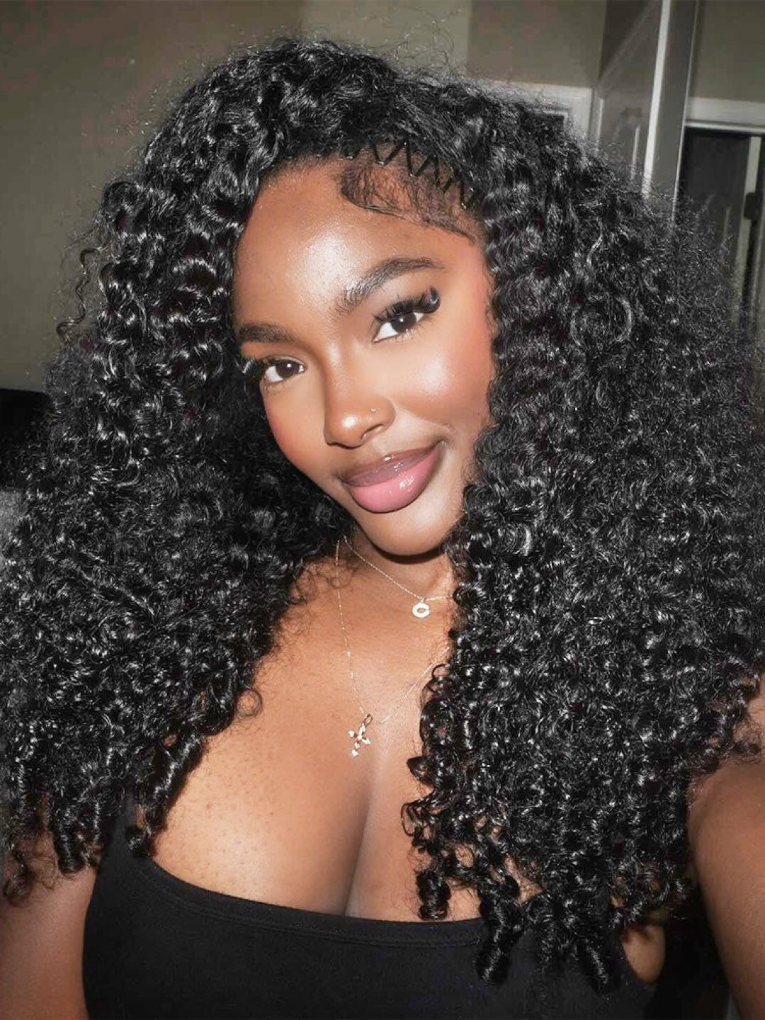 Front view of long natural black Burmese Curly hair with a defined center part